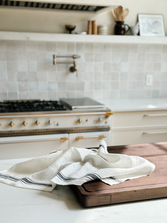 Olbia linen kitchen towel on countertop with LaCanche range in Kitchen