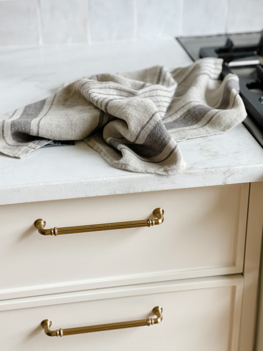 Natural Linen kitchen towel on white marble countertop