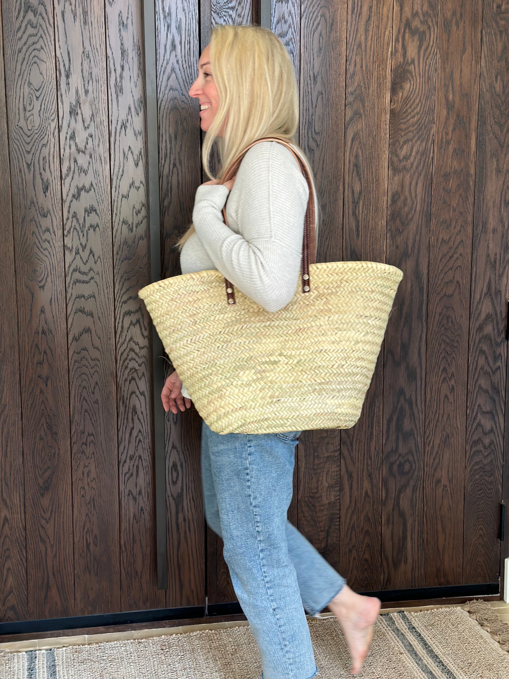 Woman carrying French Market basket over shoulder | La Maison Baude