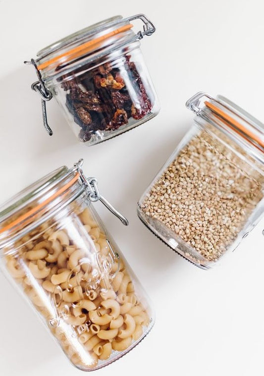 3 sizes of Le Parfait jar filled with pasta, raisins and grains