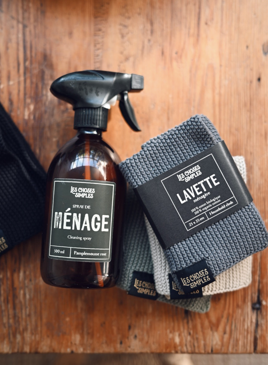 Menage Cleaning Spray and Lavette cloths on wooden table